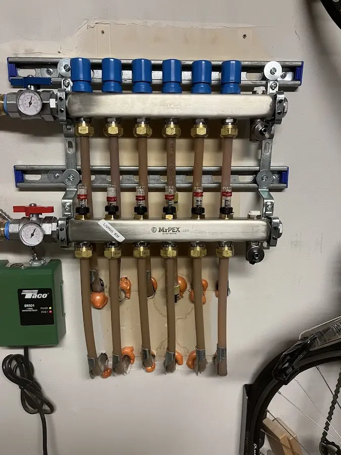 Plumber performing Gas Line Installation at a residential property in Dumbarton